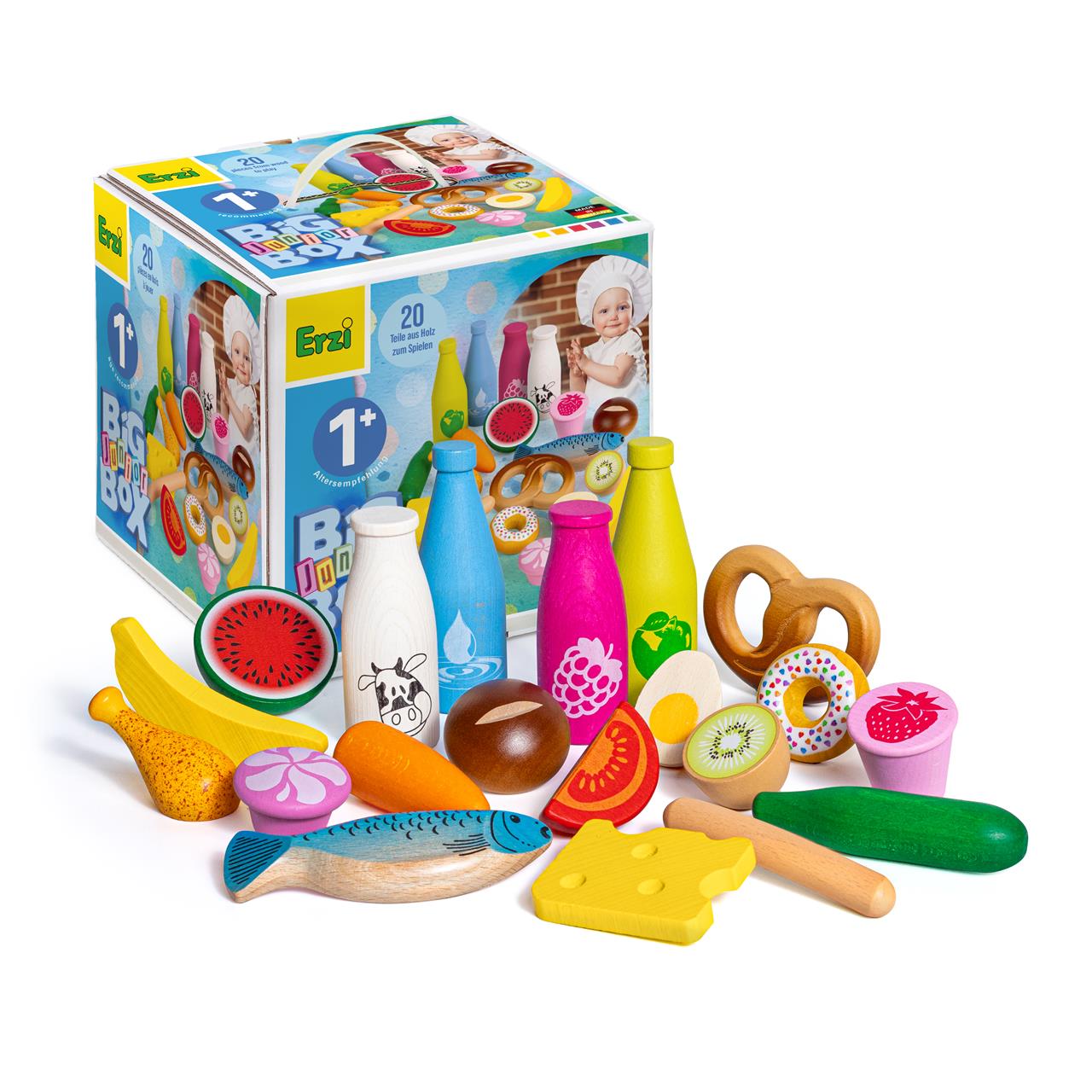 Das Bild zeigt das Produkt "Sortierung Big Box Junior," eine bunte Spielesammlung aus Holz für Kinder ab 1 Jahr. Verschiedene Spielzeug-Lebensmittel wie Obst, Gemüse, Flaschen und Backwaren sind vor einer bunt gestalteten Verpackung zu sehen.