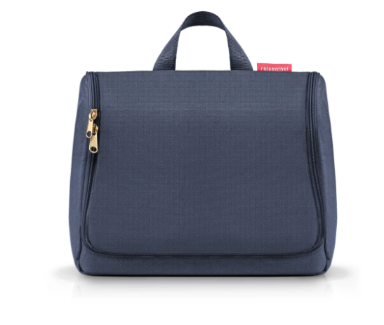 Dies ist eine Abbildung von der toiletbag XL midnight gold. Die Kulturtasche ist in Mitternachtsblau und Gold gestaltet.