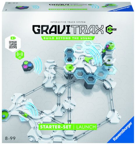 Auf dem Bild ist die Verpackung des GraviTrax Power Starter-Sets zu sehen. Die Schachtel zeigt eine Abbildung des Kugelbahnsystems mit verschiedenen Elementen und dem Schriftzug "Build Beyond The Usual".