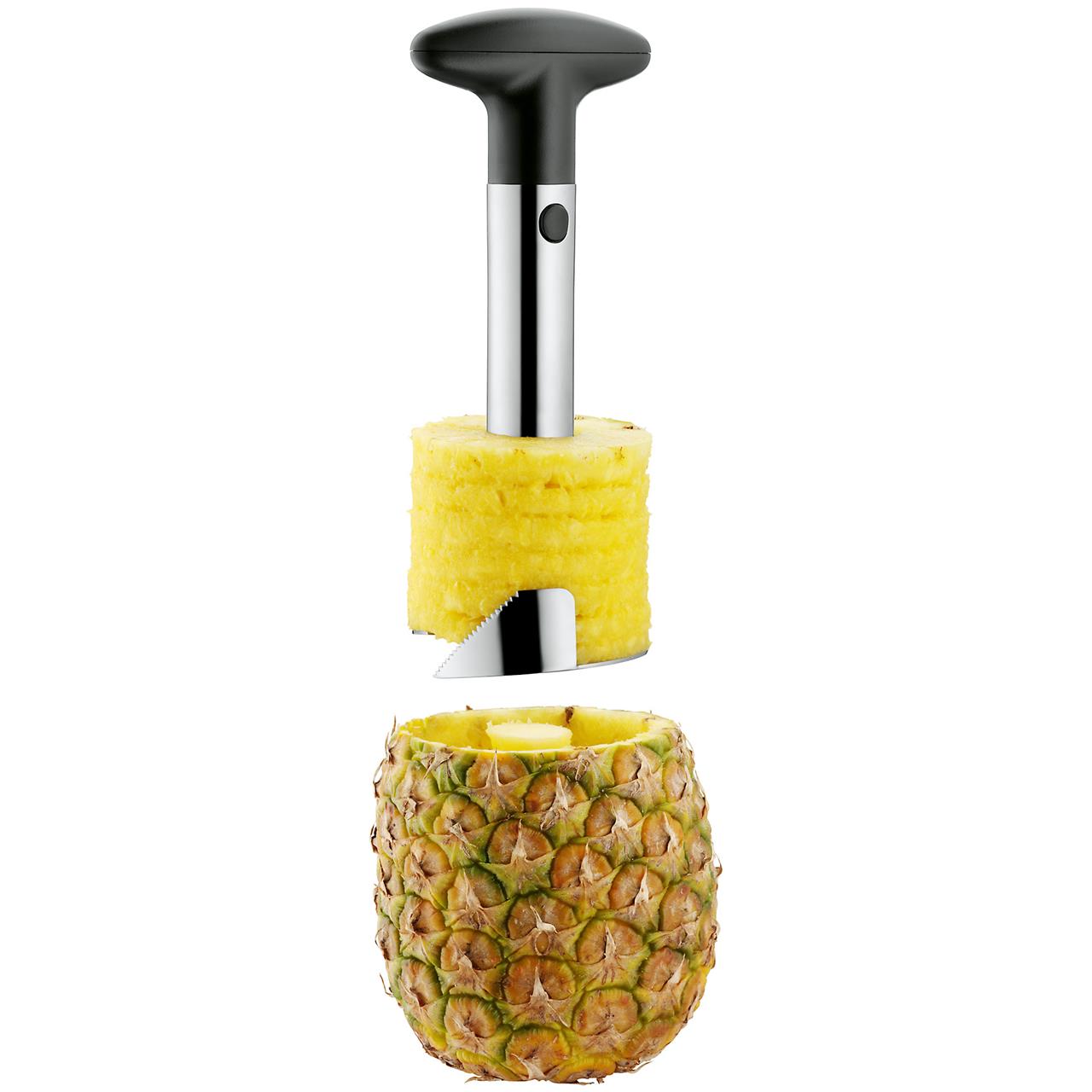 Das Bild zeigt einen Ananasschneider, der Ananas in Scheiben schneidet. Das Gerät entfernt dabei das Fruchtfleisch aus der Schale.