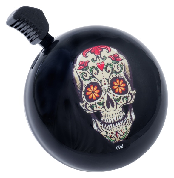 Auf dem Bild ist eine schwarze Fahrradklingel zu sehen. Sie ist mit einem bunten Totenkopf im Sugar Skull-Stil verziert.