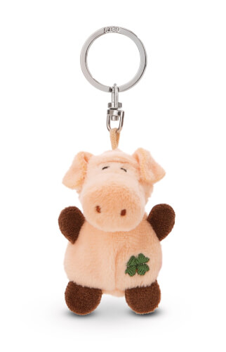 Das Bild zeigt einen Plüsch-Schlüsselanhänger in Form eines Schweinchens. Das Schwein hat braune Füße und eine kleine grüne Stickerei an der Seite.