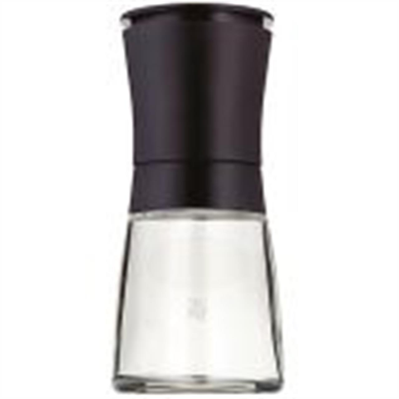 Dies ist eine leere Gewürzmühle mit schwarzem Deckel. Sie hat ein modernes und schlichtes Design.