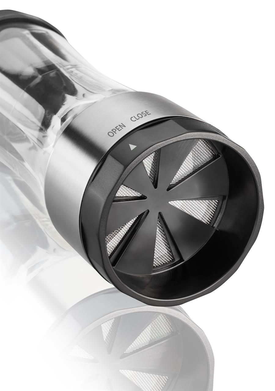 Das Bild zeigt die Puderzuckermühle Dispenso aus Metall und Kunststoff. Auf dem Deckel sind die Wörter "OPEN" und "CLOSE" zu sehen.