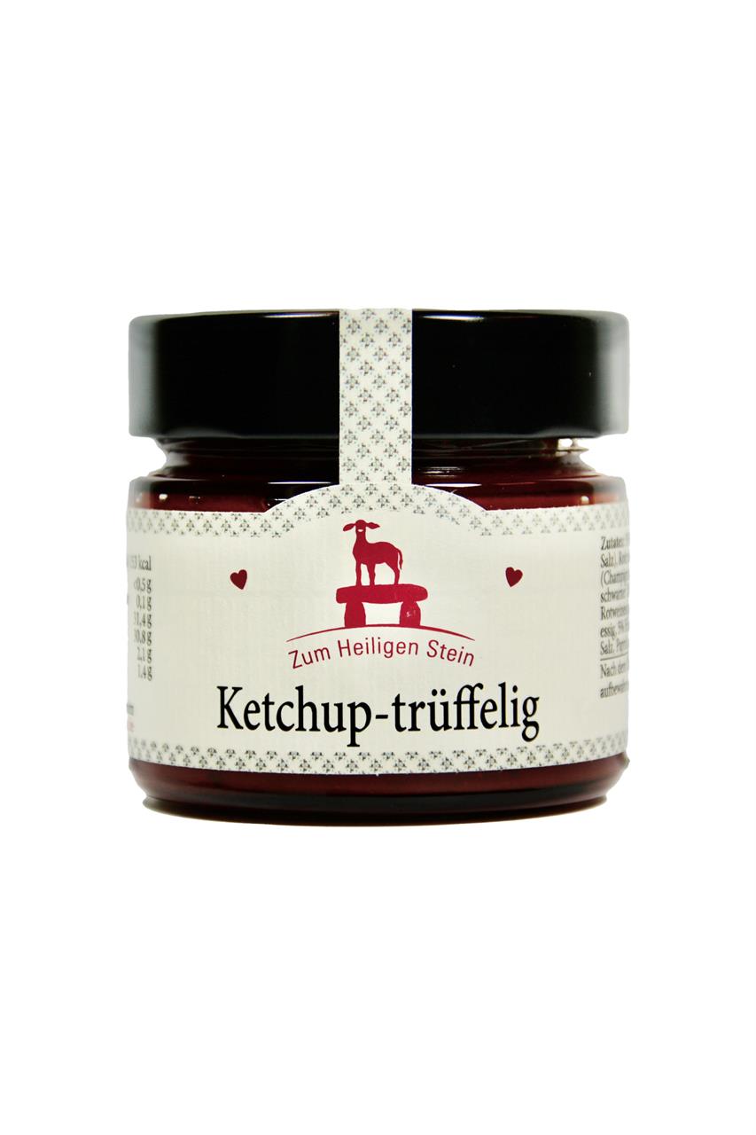 Auf dem Bild ist ein Glas mit der Aufschrift "Ketchup-trüffelig" zu sehen. Das Produkt enthält 200g und stammt von "Zum Heiligen Stein".