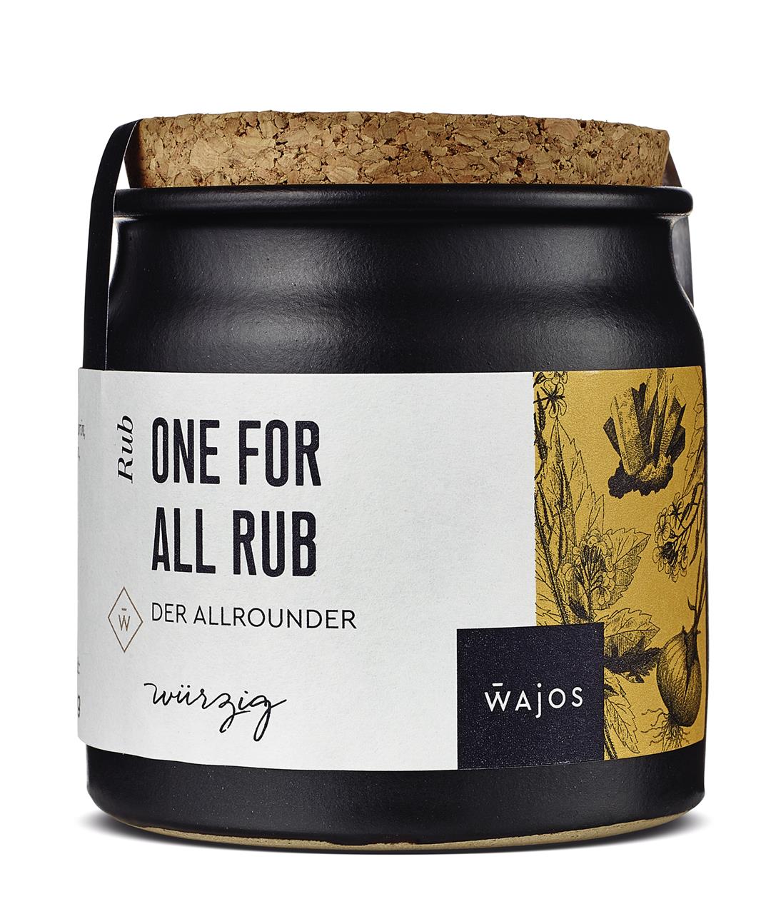 Das Bild zeigt eine Gewürzmischung namens "One For All Rub" in einem schwarzen Glas mit Korkdeckel. Auf dem Etikett steht außerdem "Wajos" und dekorative Pflanzenillustrationen sind zu sehen.