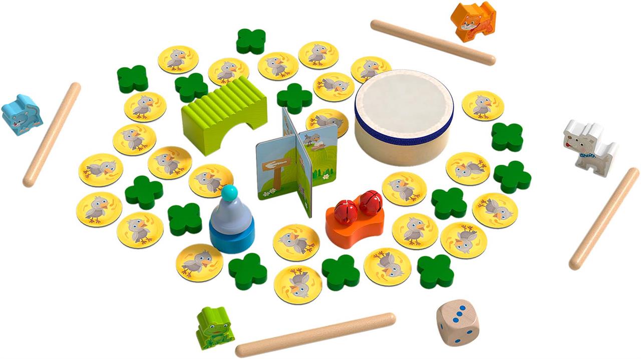 Das Bild zeigt das Spiel "Meine ersten Spiele - Klang-Spielesammlung" mit verschiedenen bunten Spielsteinen und Musikinstrumenten. Es sind Holzfiguren, ein Würfel, Plättchen, Klanginstrumente und weiteres Zubehör zu sehen.