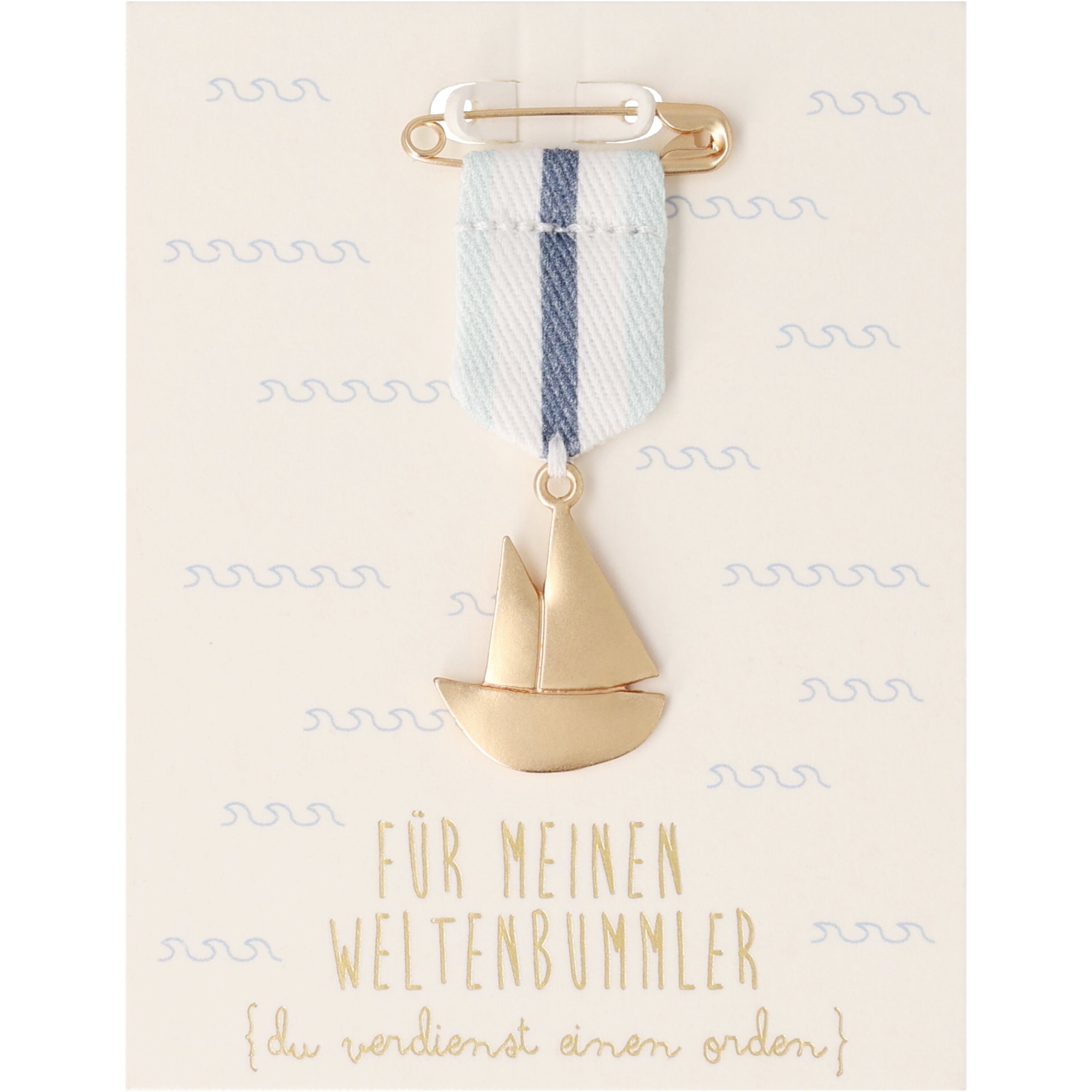 Ein Orden mit der Aufschrift 'Für meinen Weltenbummler'. Das Produkt ist ca. 5,4 cm lang und 2 cm breit.