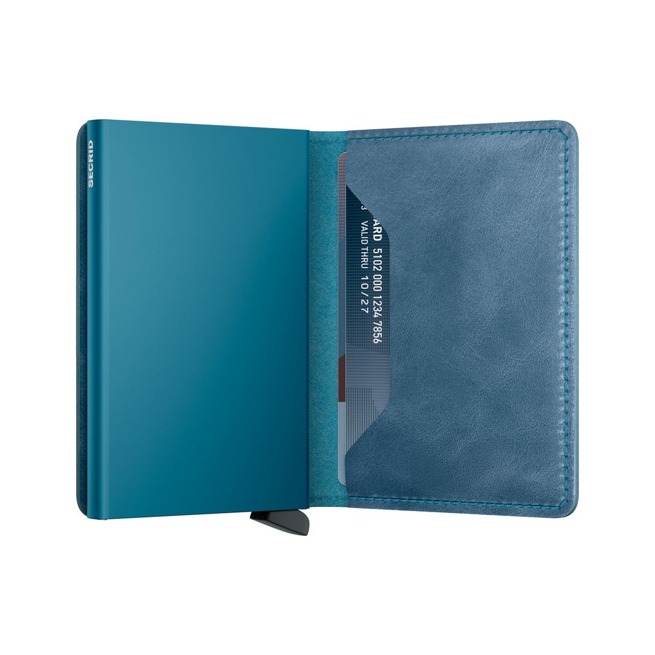 Das Bild zeigt das geöffnete Slimwallet Vintage Teal. Im Inneren sieht man Fächer für Karten und ein elegantes, teal-farbenes Design.