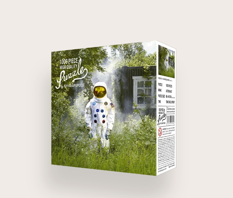 Das Bild zeigt das Produkt 'Puzzle Astronaut 1000 Teile'. Es handelt sich um ein Puzzle mit einem Astronautenmotiv und 1000 Teilen.
