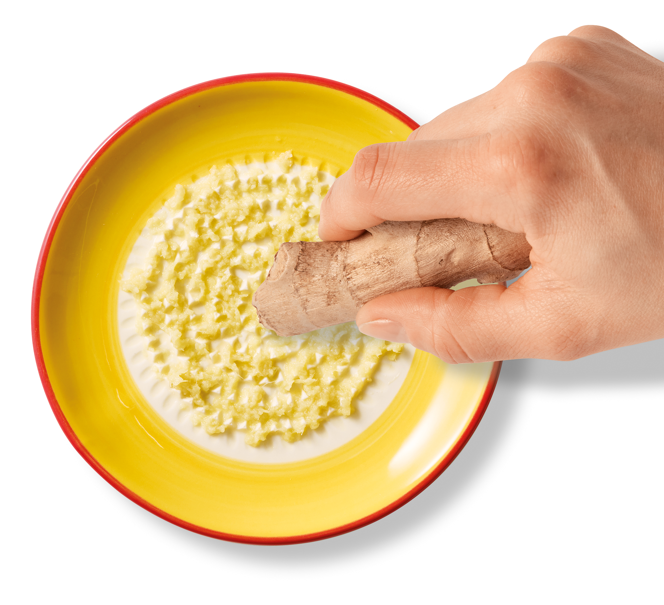 Die Tellerreibe Sole wird hier als praktisches Küchenutensil gezeigt. Sie ist ideal zum Reiben und Schneiden verschiedener Zutaten.