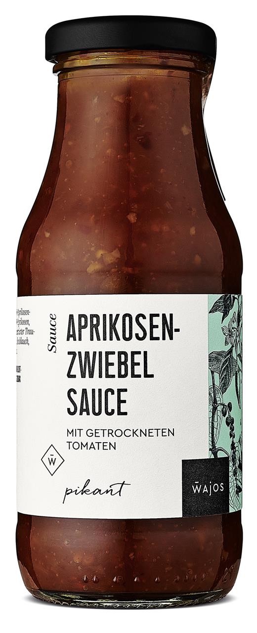 Das Bild zeigt eine Flasche Aprikosen-Zwiebel Sauce mit 245 ml Inhalt. Auf dem Etikett steht, dass die Sauce getrocknete Tomaten enthält und pikant ist.