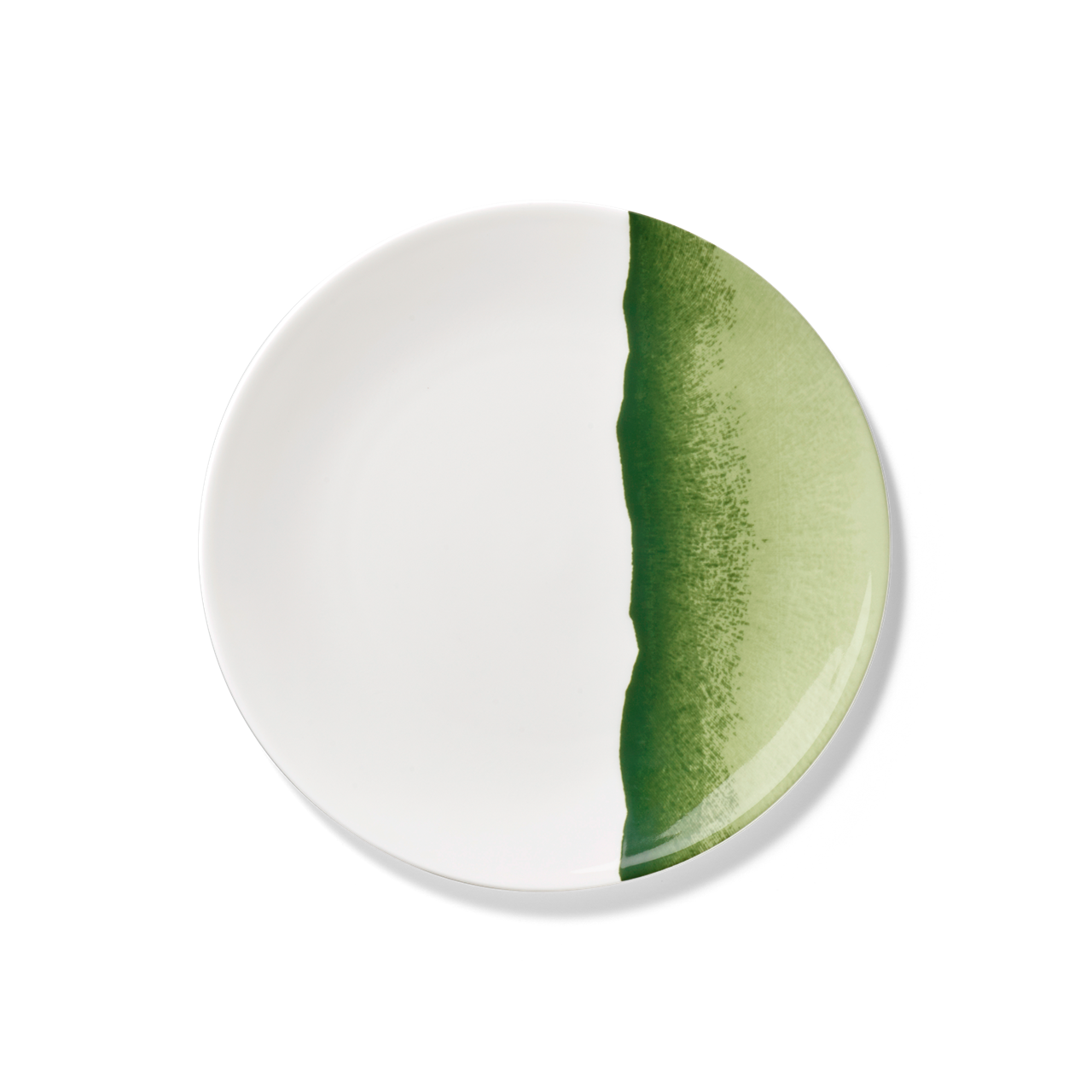 Der Teller ist rund und überwiegend weiß. Ein breiter, grüner Streifen verläuft unregelmäßig entlang einer Seite des Tellers.