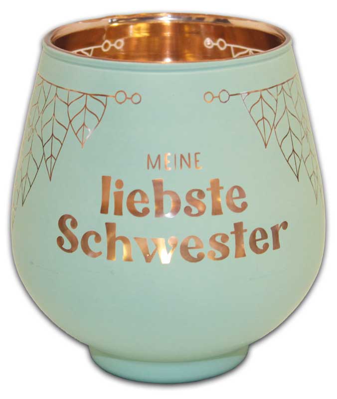 Das Bild zeigt ein Windlicht mit der Aufschrift "Meine liebste Schwester". Das Windlicht ist in einem sanften Mintgrün gehalten und hat goldene Verzierungen.