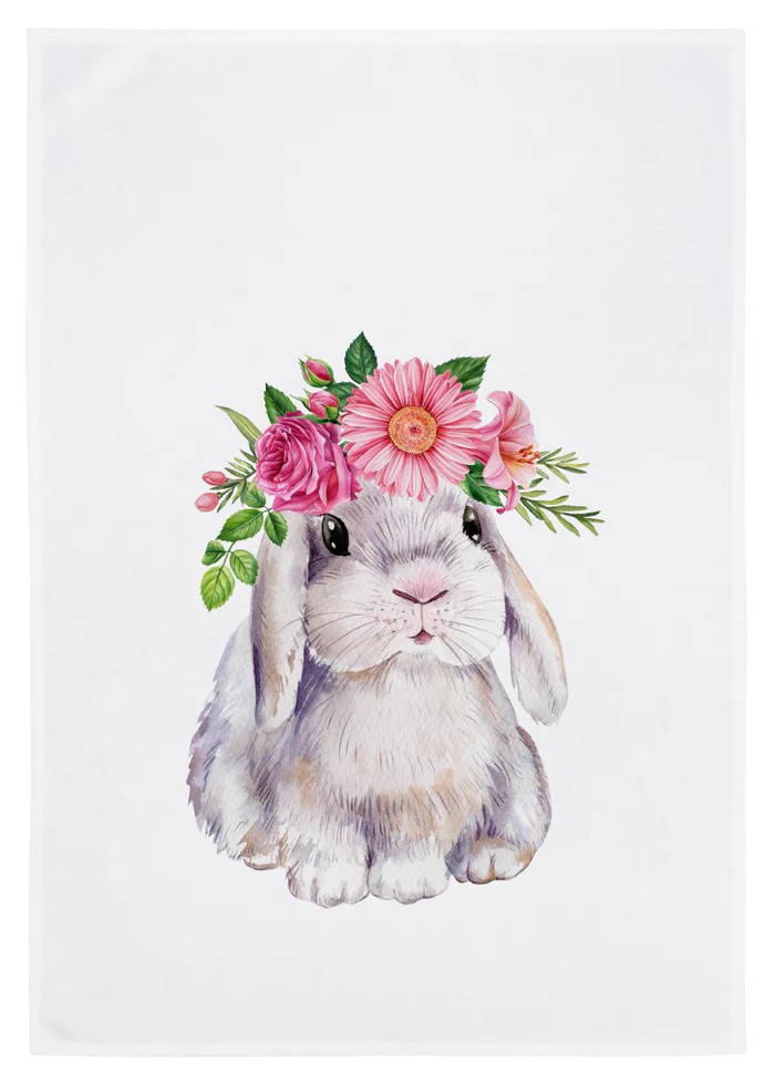 Das Bild zeigt das Geschirrtuch "Flower Bunny" aus Baumwolle. Es ist ein dekoratives Küchenaccessoire mit Blumen- und Hasenmotiv.
