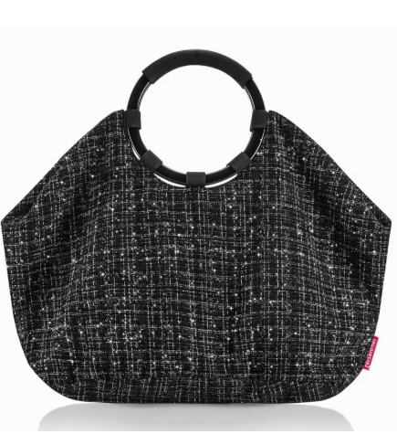 Dies ist die loopbag bouclé black. Eine elegante Tasche aus Bouclé in Schwarz.