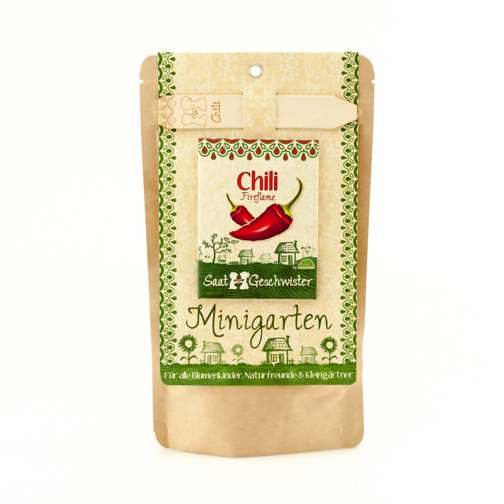 Das Bild zeigt die Produktverpackung "Saatgeschwister Minigarten Chili (Bio)". Auf der Verpackung sind zwei rote Chilis und dekorative grüne Muster abgebildet.