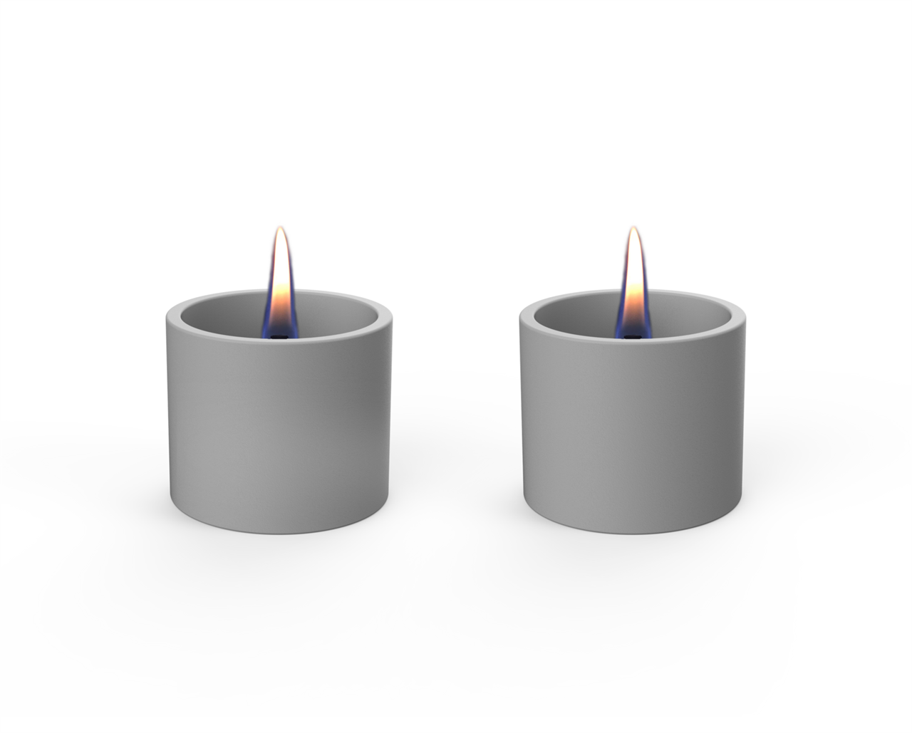 Auf dem Bild sind zwei graue Tischfeuer im modernen Design zu sehen. Beide Gefäße brennen mit einer sichtbaren, ruhigen Flamme.