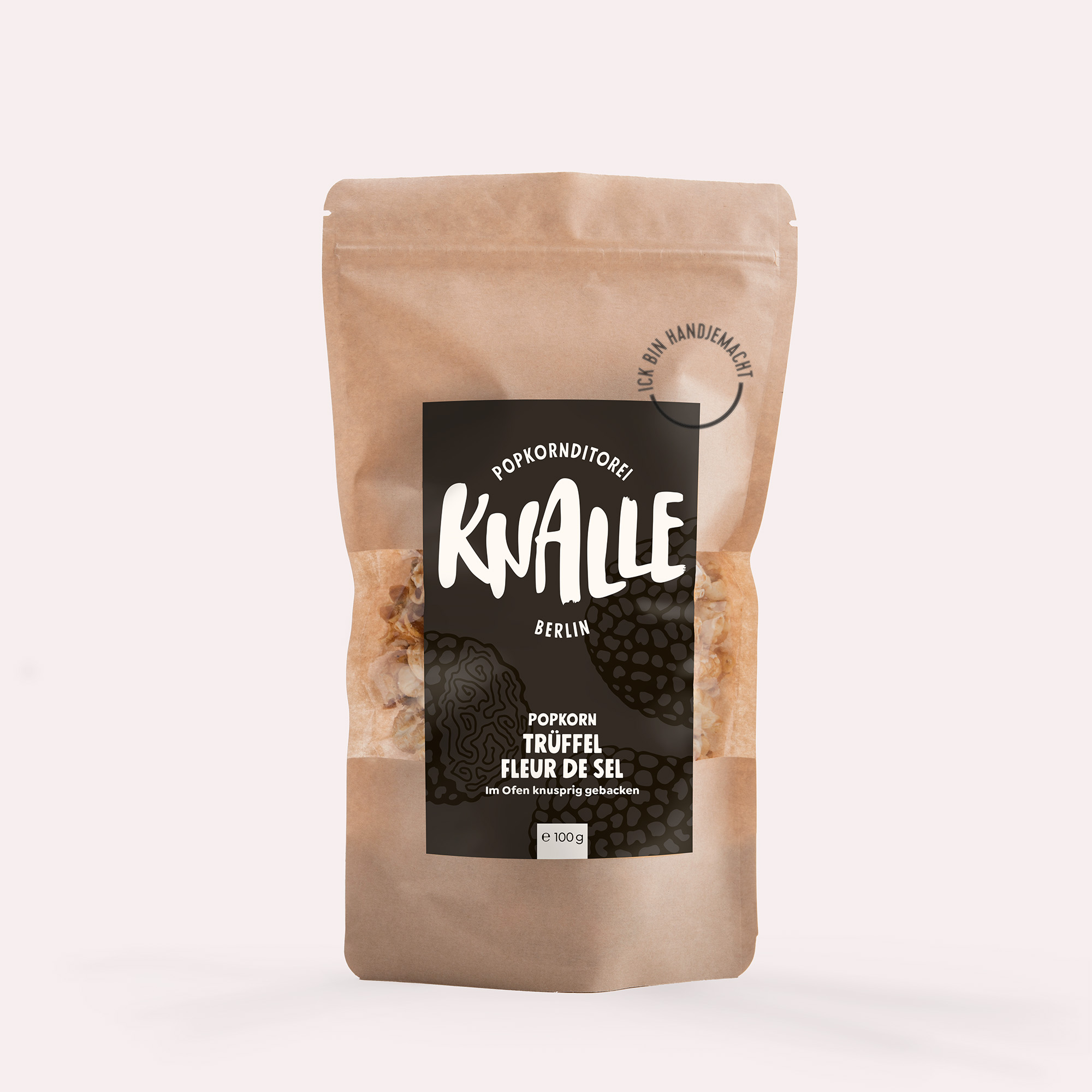 Knalle Popkorn Trüffel Fleur De Sel 100g in einer rosa Verpackung. Das Produkt ist für Feinschmecker geeignet.