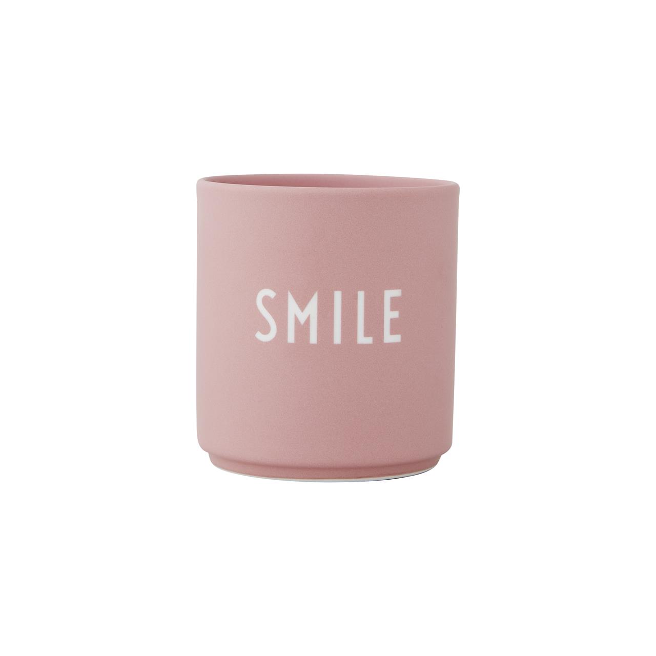 Die Abbildung zeigt einen rosa Becher mit der Aufschrift "SMILE". Der Becher ist aus der Moods Collection und misst 8,5 x 8 cm.