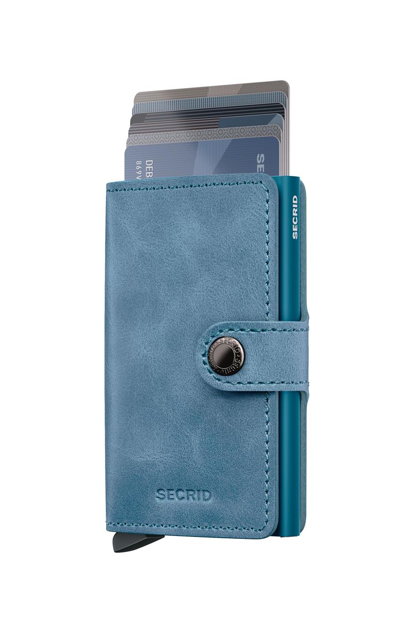 Das Bild zeigt ein kompaktes Miniwallet in der Farbe Vintage Teal. Das Portemonnaie ist geöffnet und mehrere Karten sind sichtbar.
