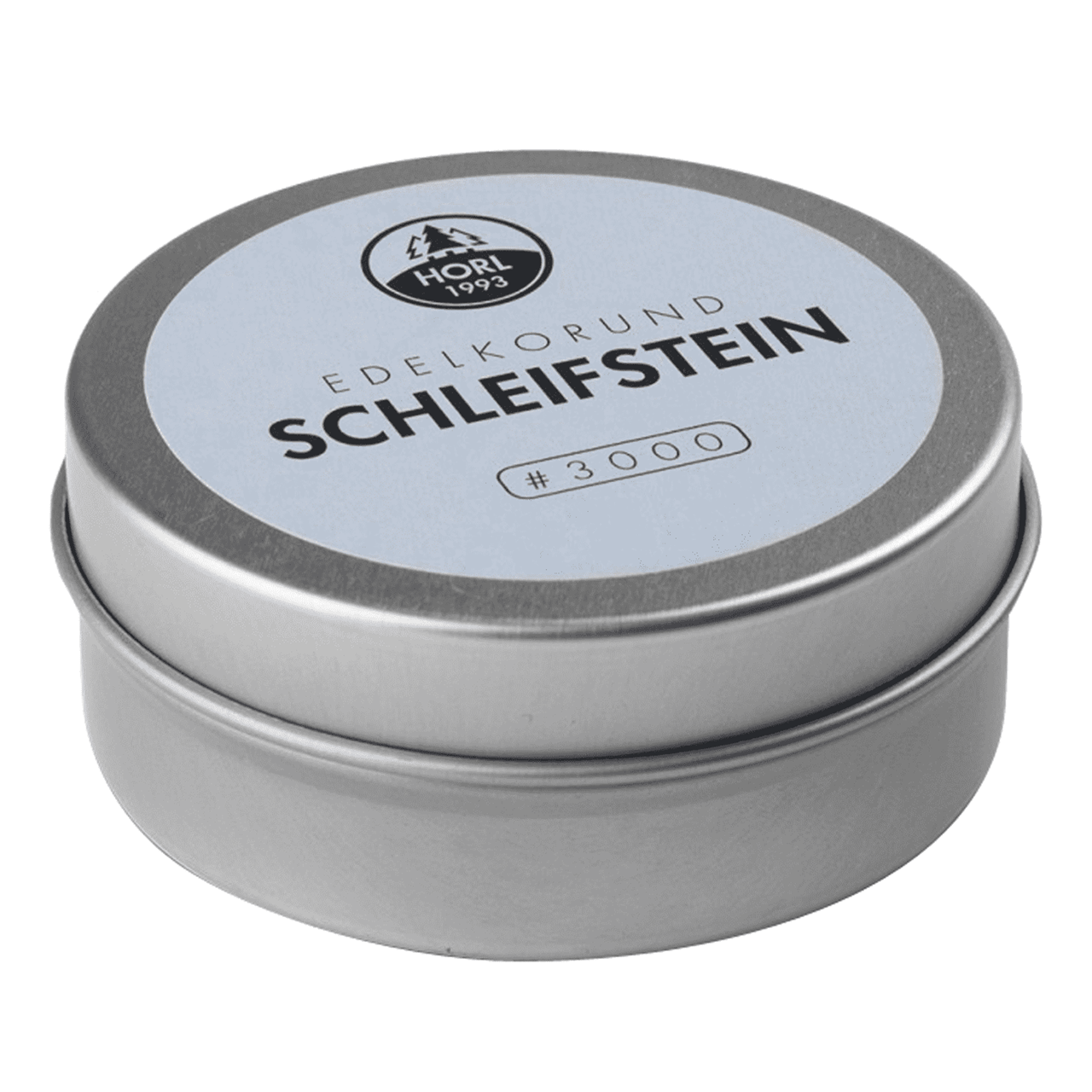 Das Bild zeigt einen feinen Schleifstein (Horl 2) mit der Körnung 3000. Die Verpackung ist rund und trägt die Aufschrift „Edelkorund Schleifstein“.