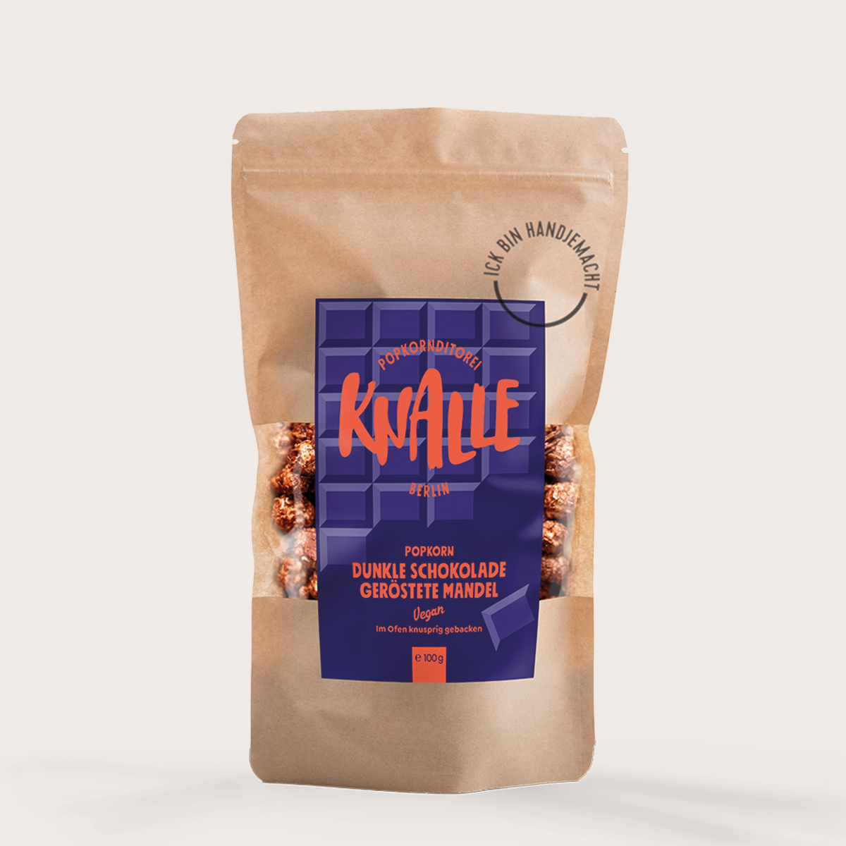 Abgebildet ist die Verpackung von Knalle Dunkle Schokolade Mandel 100g vegan. Dieses Produkt kombiniert dunkle Schokolade mit knackigen Mandeln.