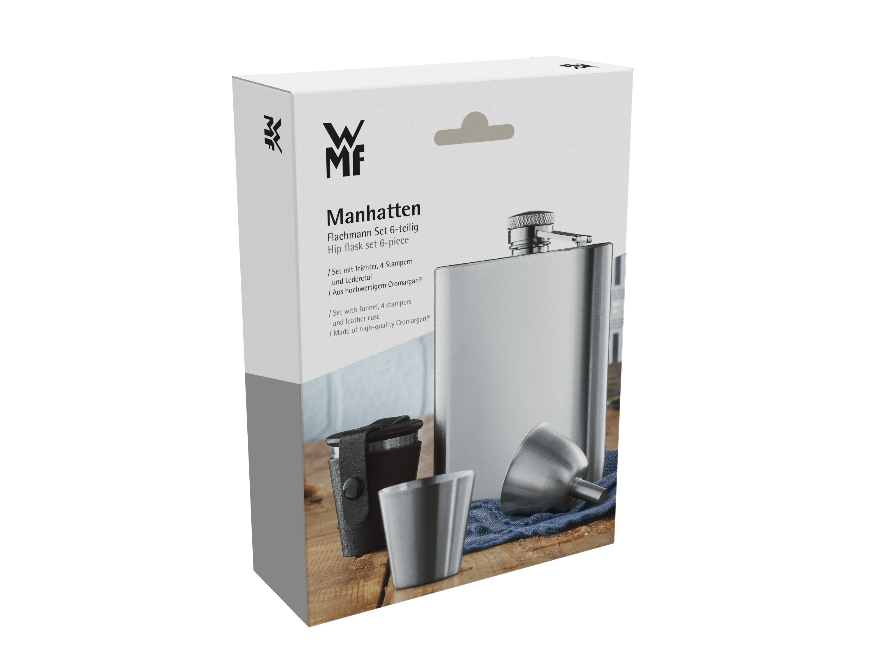 Auf dem Bild ist eine Verpackung des WMF Manhatten Flachmann Sets zu sehen. Das Set besteht aus einem Flachmann, vier Stampern, einem Trichter und einem Lederetui.