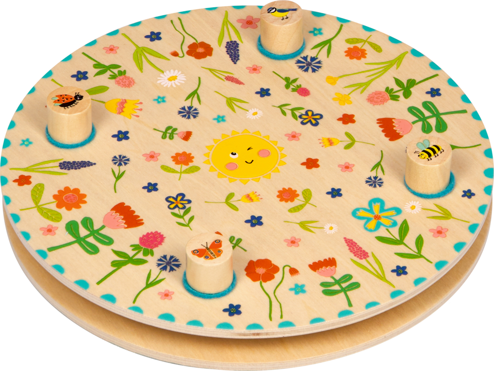 Hier ist die Blumenpresse - Spiegelburg Sommerkinder zu sehen. Mit diesem Produkt können Kinder Blumen und Blätter pressen.