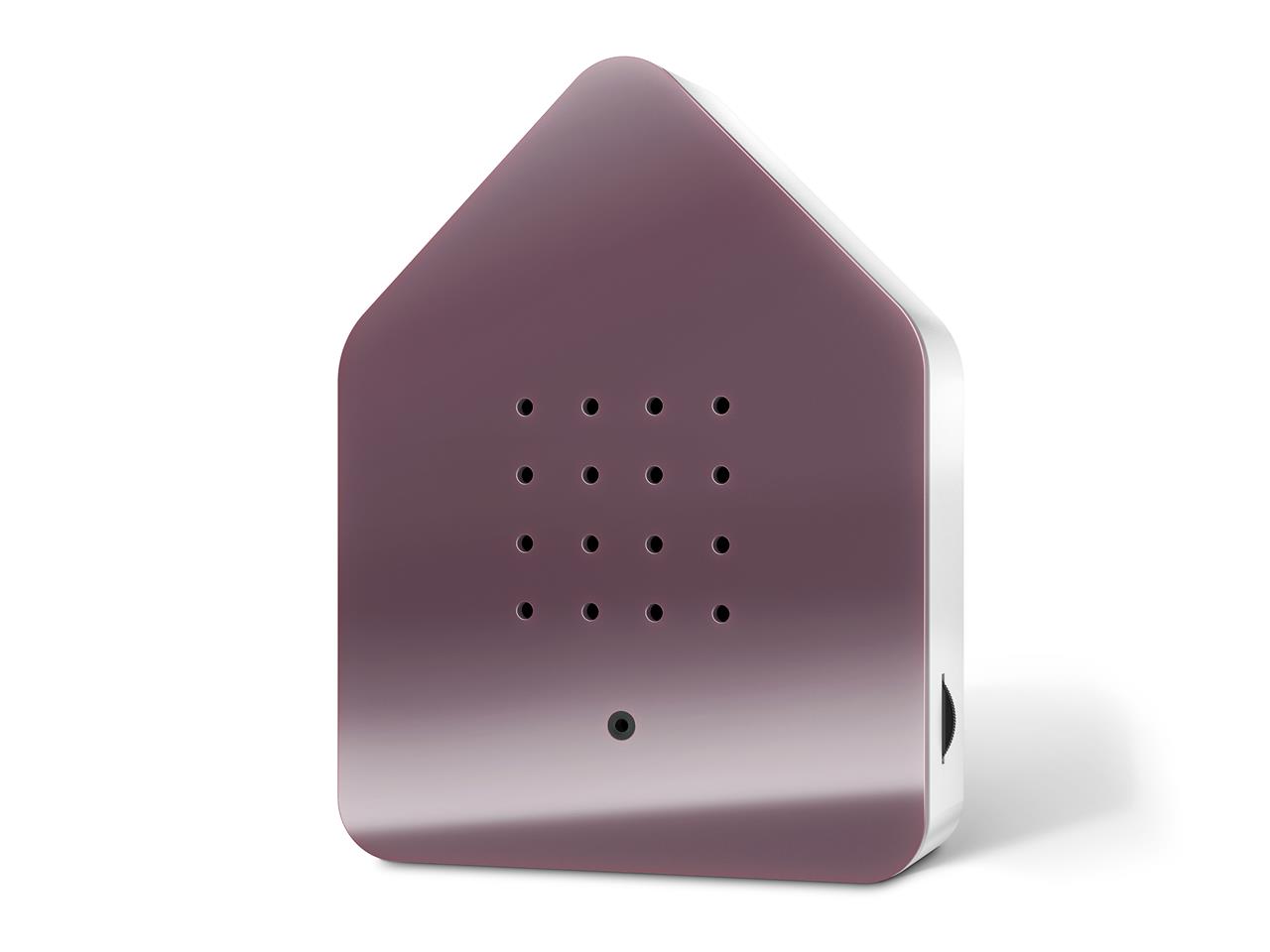 Die Abbildung zeigt die Zwitscherbox Klassik in der Farbe Mauve. Das Gerät hat die Form eines kleinen Häuschens mit abgerundeten Ecken und mehreren kleinen Löchern auf der Vorderseite.