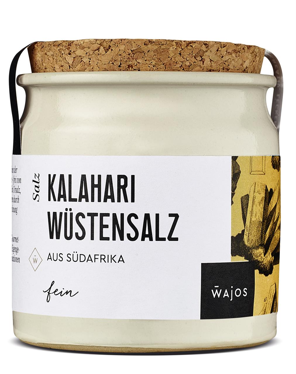 Das Bild zeigt ein Glas mit Kalahari Wüstensalz aus Südafrika. Das Glas hat einen Korkverschluss und ein weißes Etikett mit schwarzer Schrift.