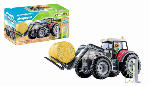 Das Bild zeigt ein Playmobil Country Traktor-Set mit einer großen gelben Heuballen-Ladung. Im Hintergrund ist die Verpackung des Sets abgebildet.