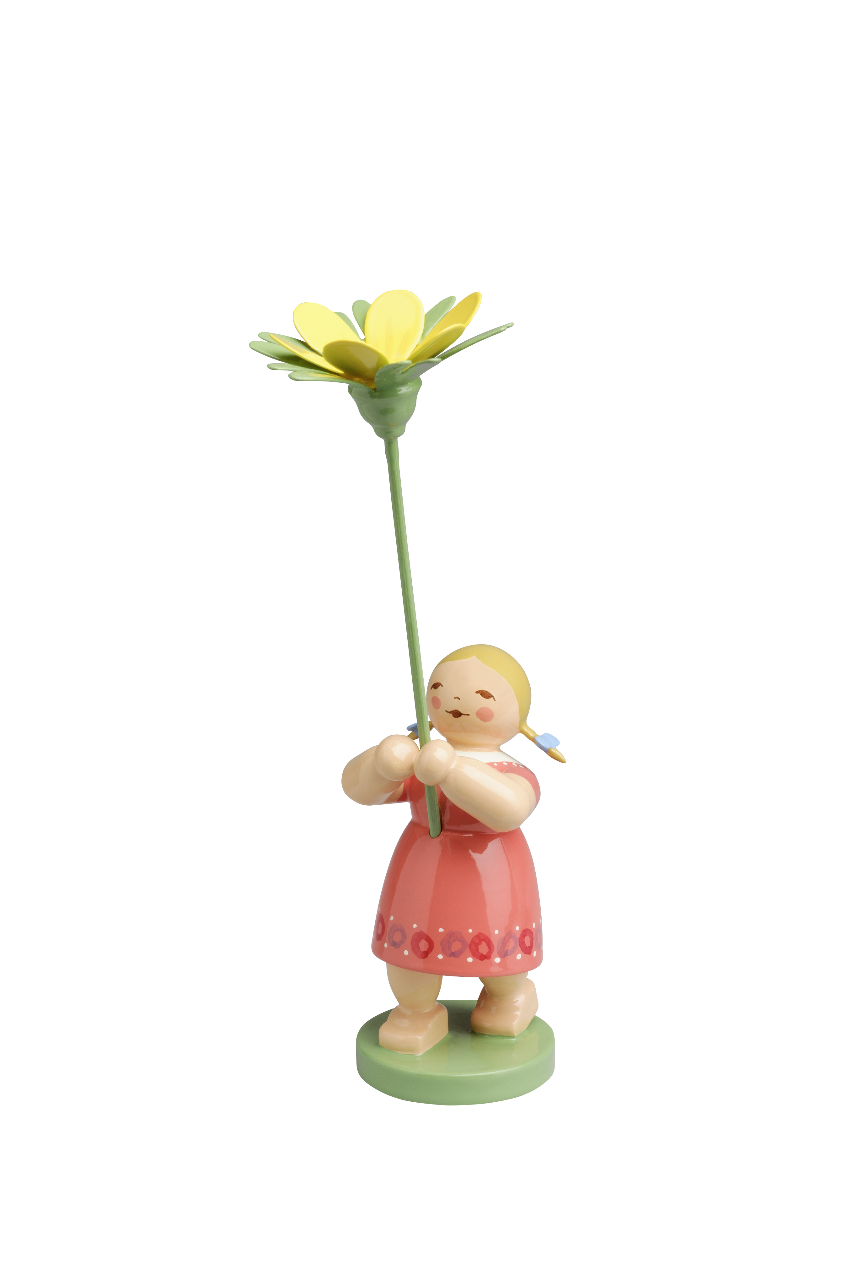 Mädchen mit Winterling: Ein Mädchen hält einen Winterling in der Hand. Das Produkt zeigt eine detailreiche Darstellung einer Figur im Frühling.