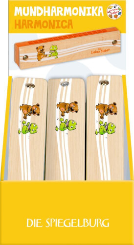 Das Bild zeigt eine Mundharmonika mit einer Verpackung in Gelb und Weiß. Auf der Mundharmonika sind eine braune Bärenfigur und ein grüner Frosch abgebildet.
