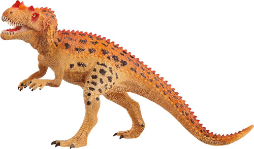 Das Bild zeigt eine Spielzeugfigur eines Dinosauriers mit orangebrauner Haut und roten Stacheln auf dem Rücken. Der Dinosaurier hat schwarze Flecken und steht aufrecht mit geöffnetem Maul.