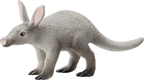 Das Bild zeigt eine graue Plastikfigur eines Erdferkels. Das Tier hat große Ohren, einen langen Schwanz und steht auf allen vier Beinen.