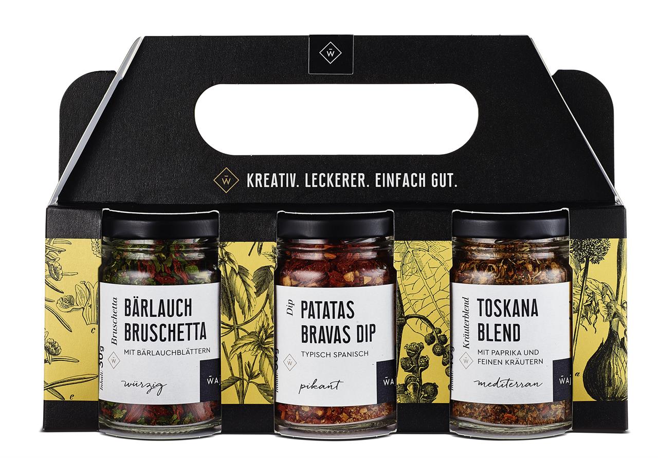Das Bild zeigt ein Kräuter-Set mit drei verschiedenen Gewürzmischungen in Gläsern. Enthalten sind Bärlauch Bruschetta, Patatas Bravas Dip und Toskana Blend.