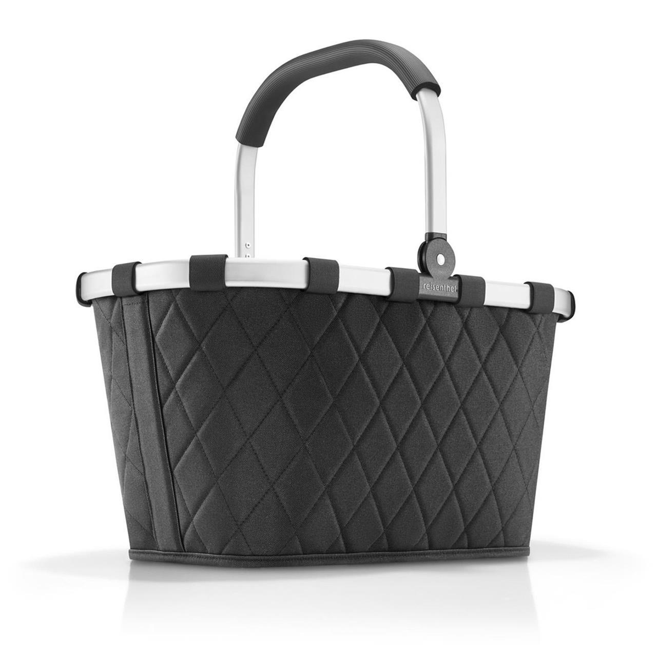 Der Einkaufskorb "Carrybag rhombus black" ist in einem eleganten schwarzen Rautenmuster gestaltet. Er hat einen stabilen Aluminiumrahmen und einen komfortablen Tragegriff.