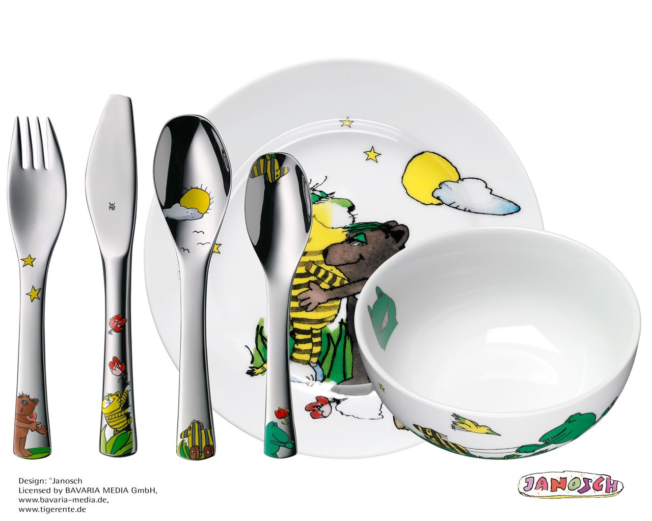 Das Bild zeigt das "Kinderbesteck Set 6 Janosch" mit Kindergeschirr und Besteck, das mit bunten Janosch-Motiven verziert ist. Das Set beinhaltet einen Teller, eine Schüssel, eine Gabel, ein Messer und zwei Löffel.
