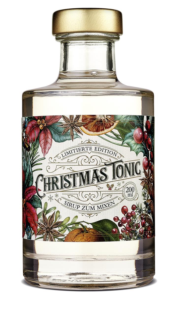 Die Abbildung zeigt eine Flasche mit der Aufschrift "Christmas Tonic Sirup 200ml". Das Etikett ist weihnachtlich gestaltet und der Sirup ist eine limitierte Edition zum Mixen.