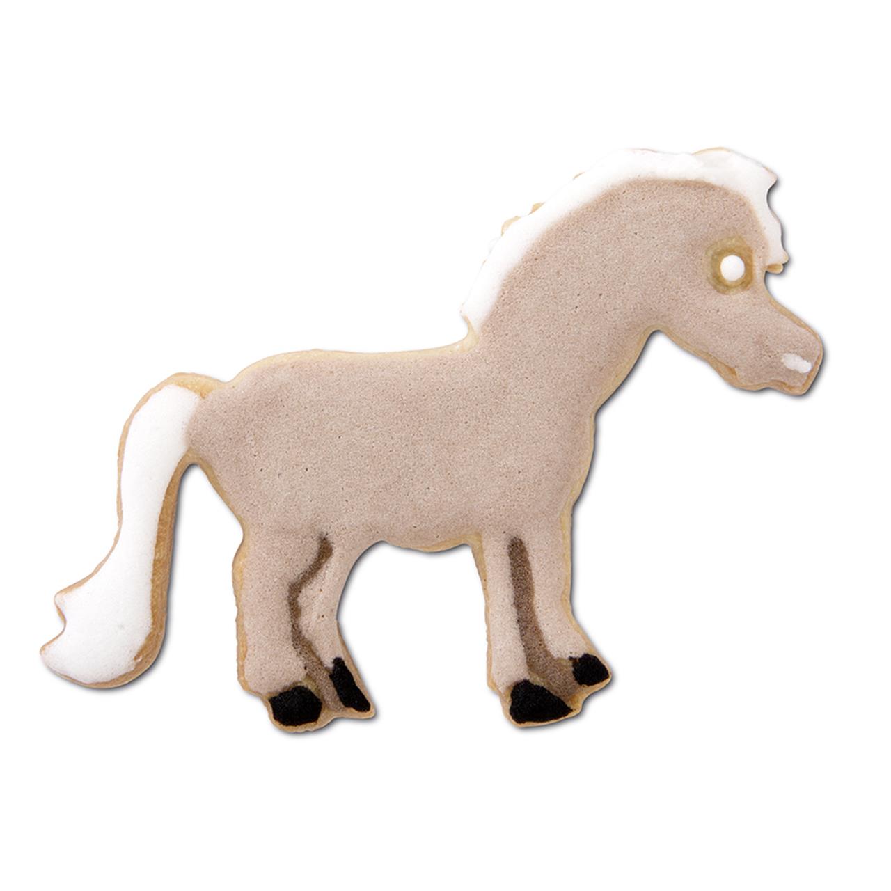 Das Bild zeigt einen Keks in Form eines Ponys, verziert mit Zuckerguss. Das Produkt heißt "Ausstecher, Pony 6 cm".