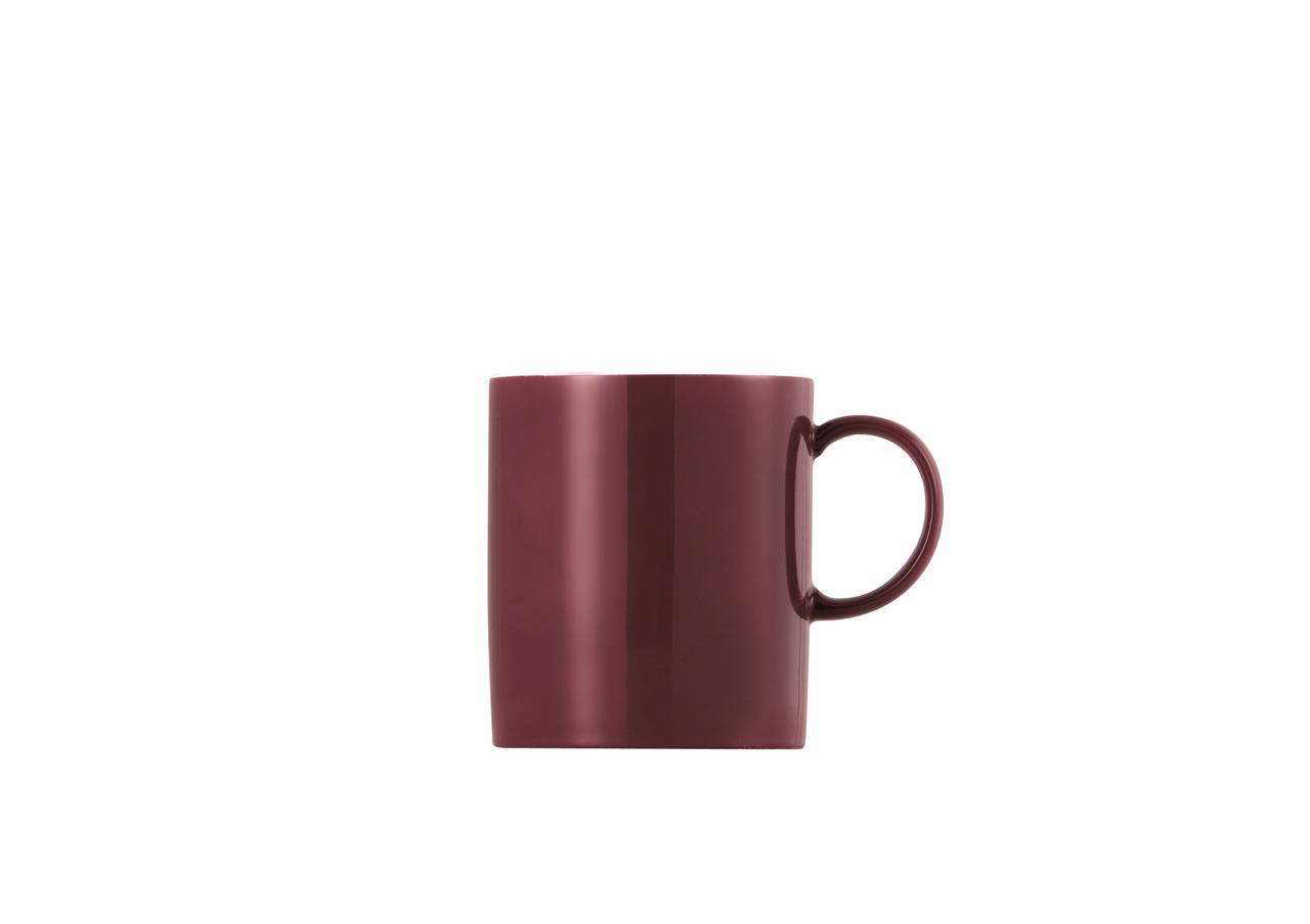 Auf dem Bild ist ein Becher mit Henkel in der Farbe Fuchsia zu sehen. Der Becher hat ein Fassungsvermögen von 0,3 Litern und stammt aus der Serie "Sunny Day".