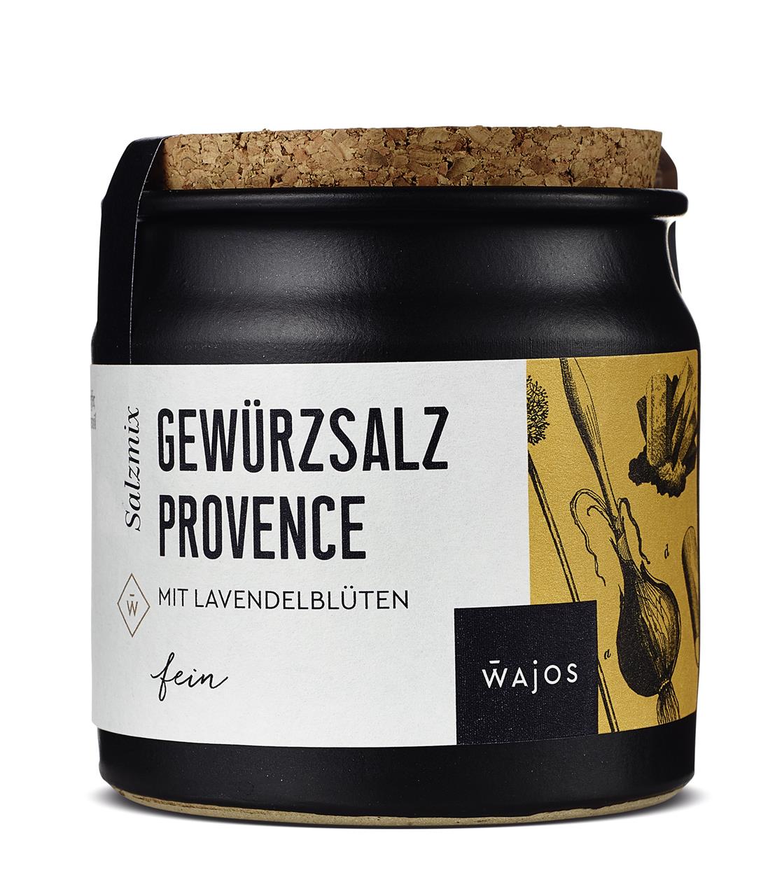 Das Bild zeigt einen schwarzen Behälter mit einem Korkdeckel, auf dem das Produkt „Gewürzsalz Provence“ von Wajos zu sehen ist. Auf dem Etikett steht, dass das Gewürzsalz Lavendelblüten enthält.